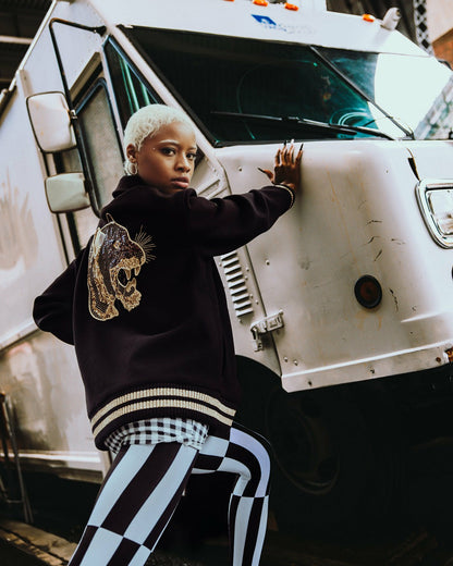 A.I.9 AFRICAN INTELLIGENCE GUILDED LEOPARD - SANDFLOWER COLLAB VARSITY | Sprayground US